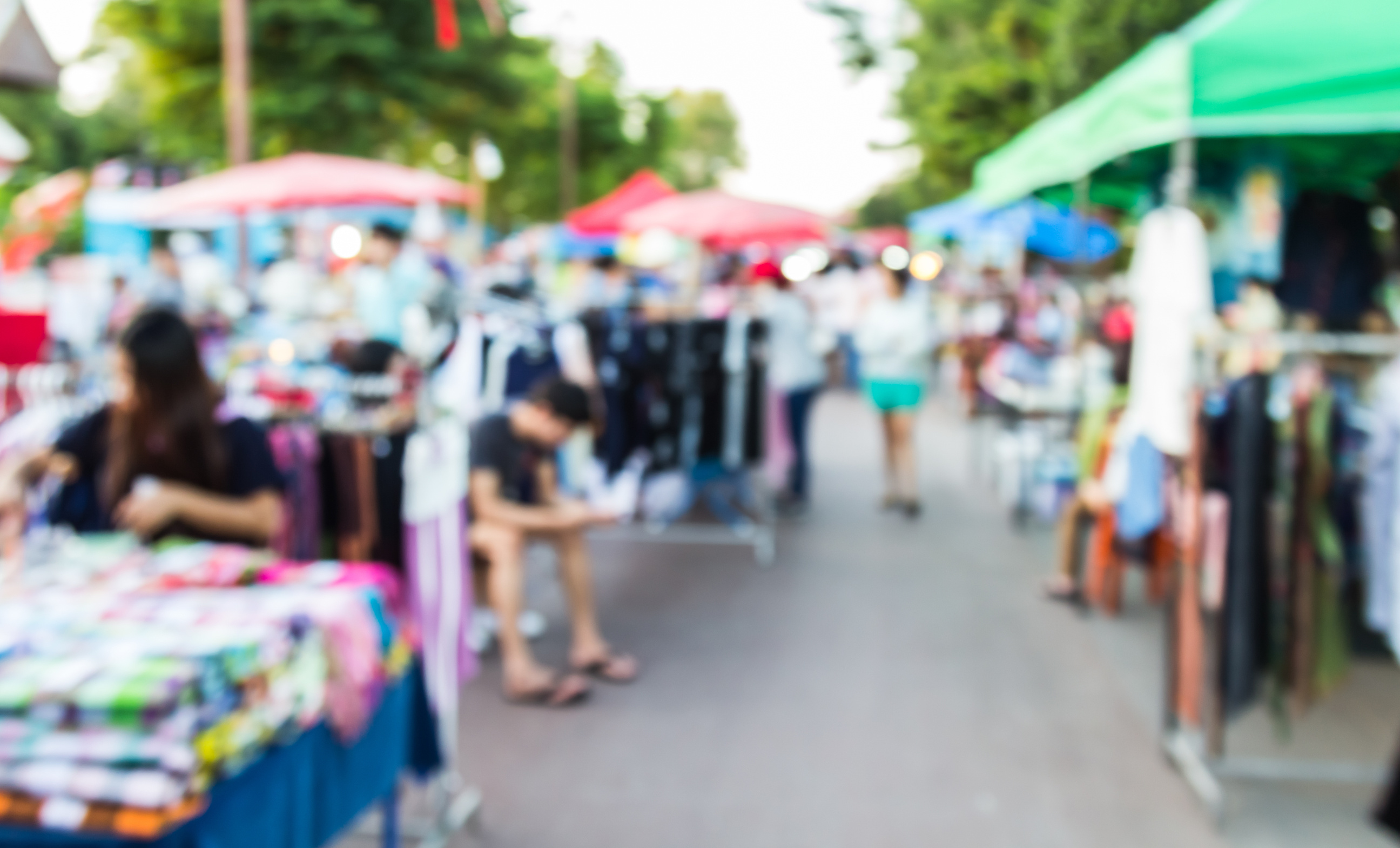 abstract blur background of people shopping at market fair